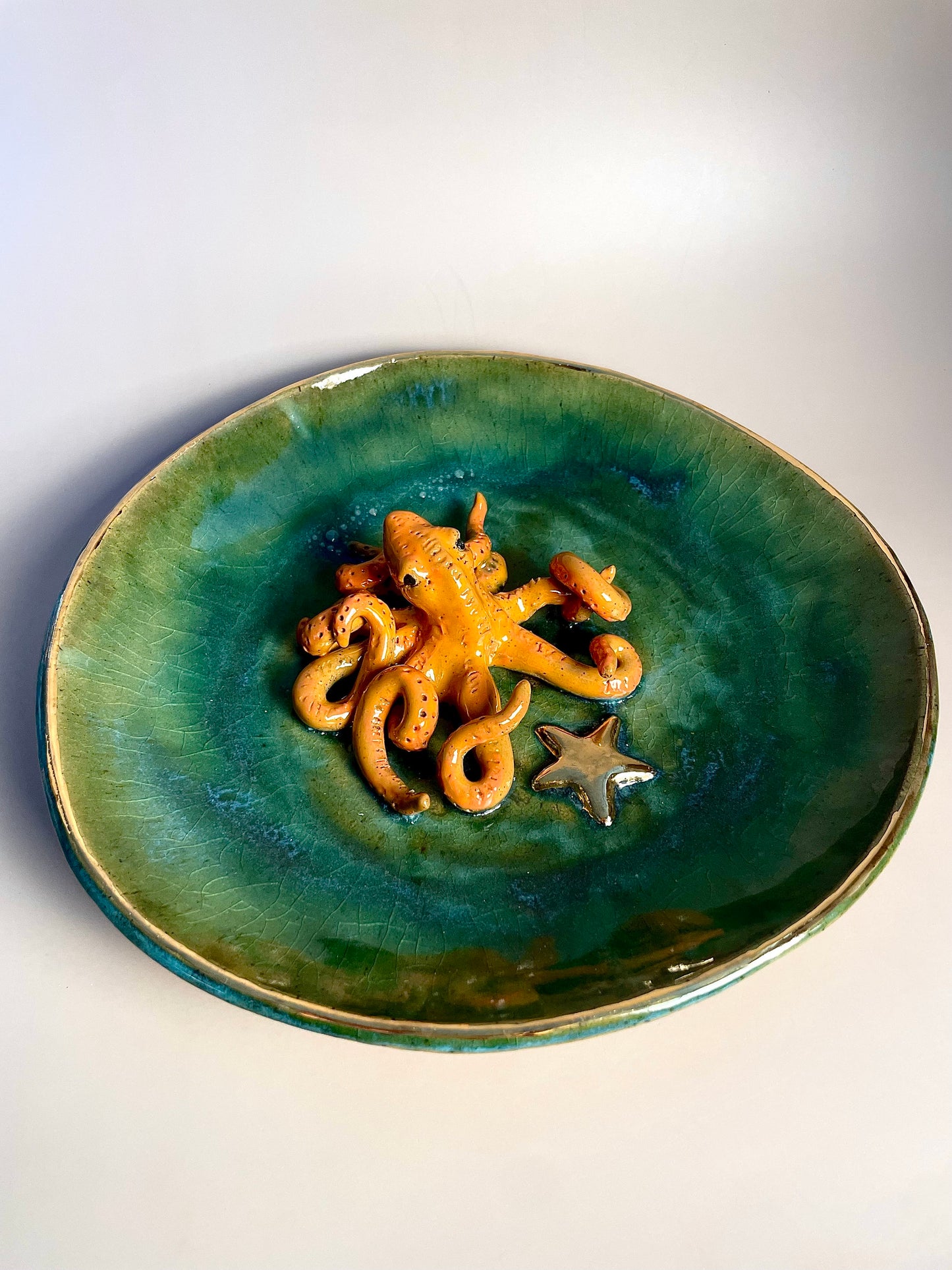 Handmade ceramic Octopus in dish with Gold Star