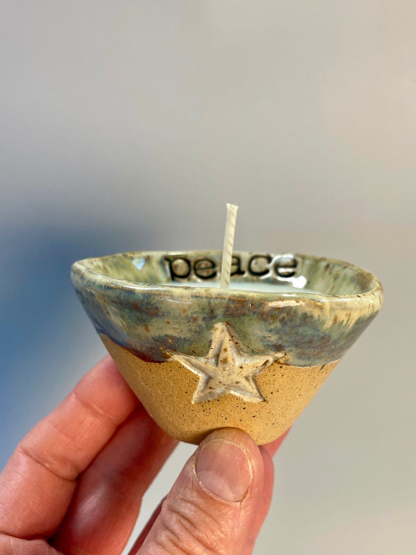 Handmade ceramic PEACE candles with star