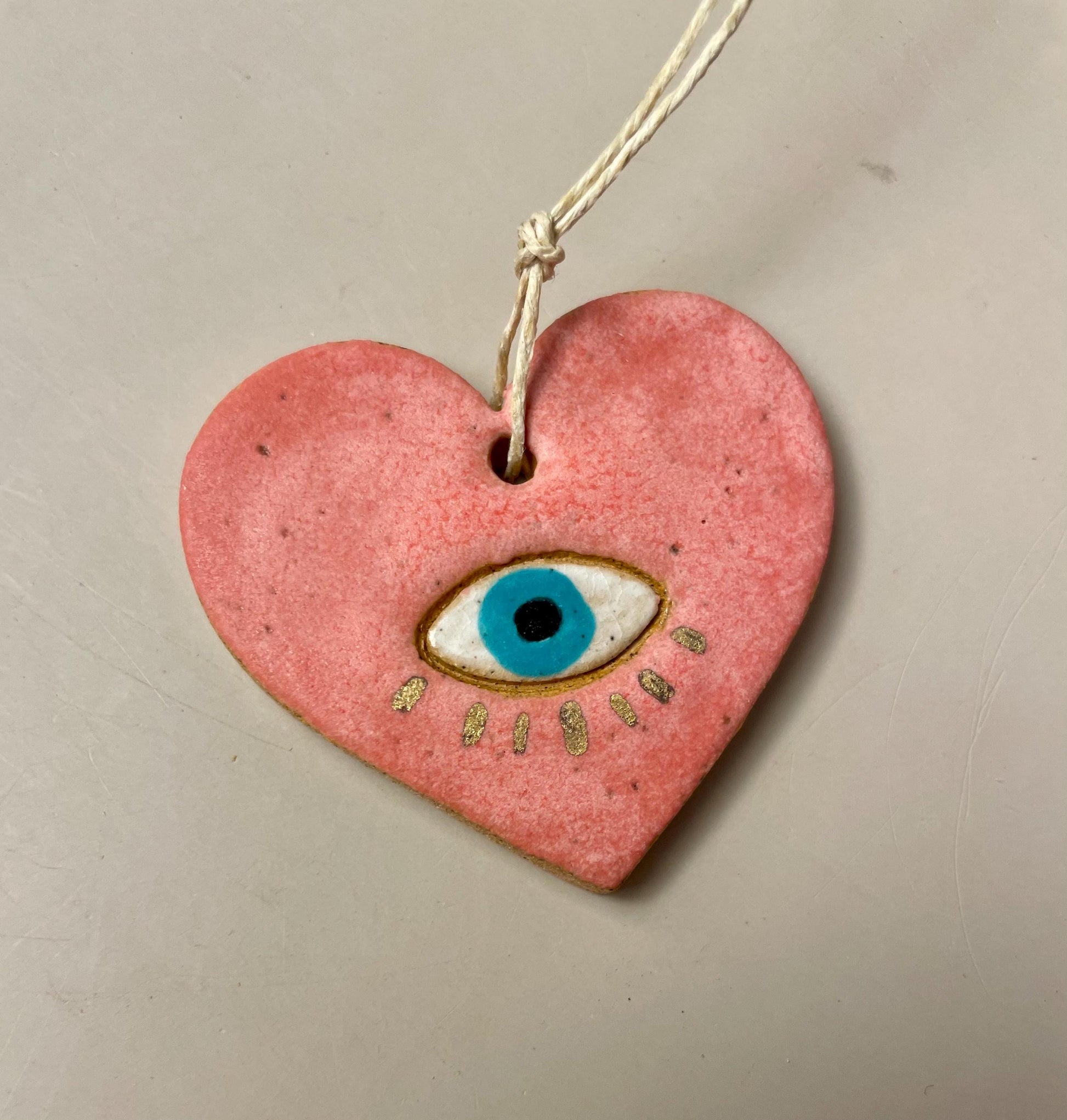 Handmade ceramic heart with eye charms