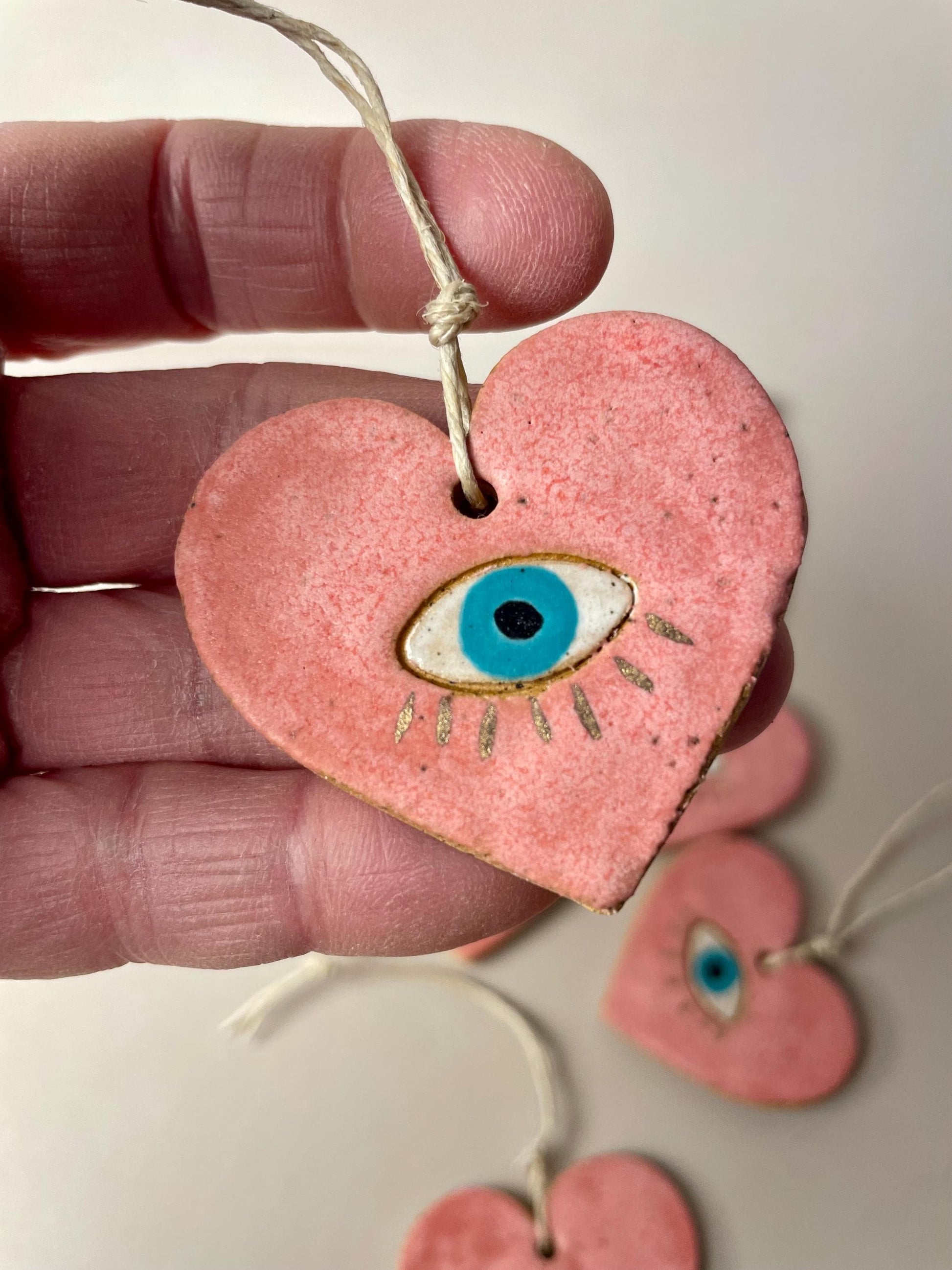 Handmade ceramic heart with eye charms