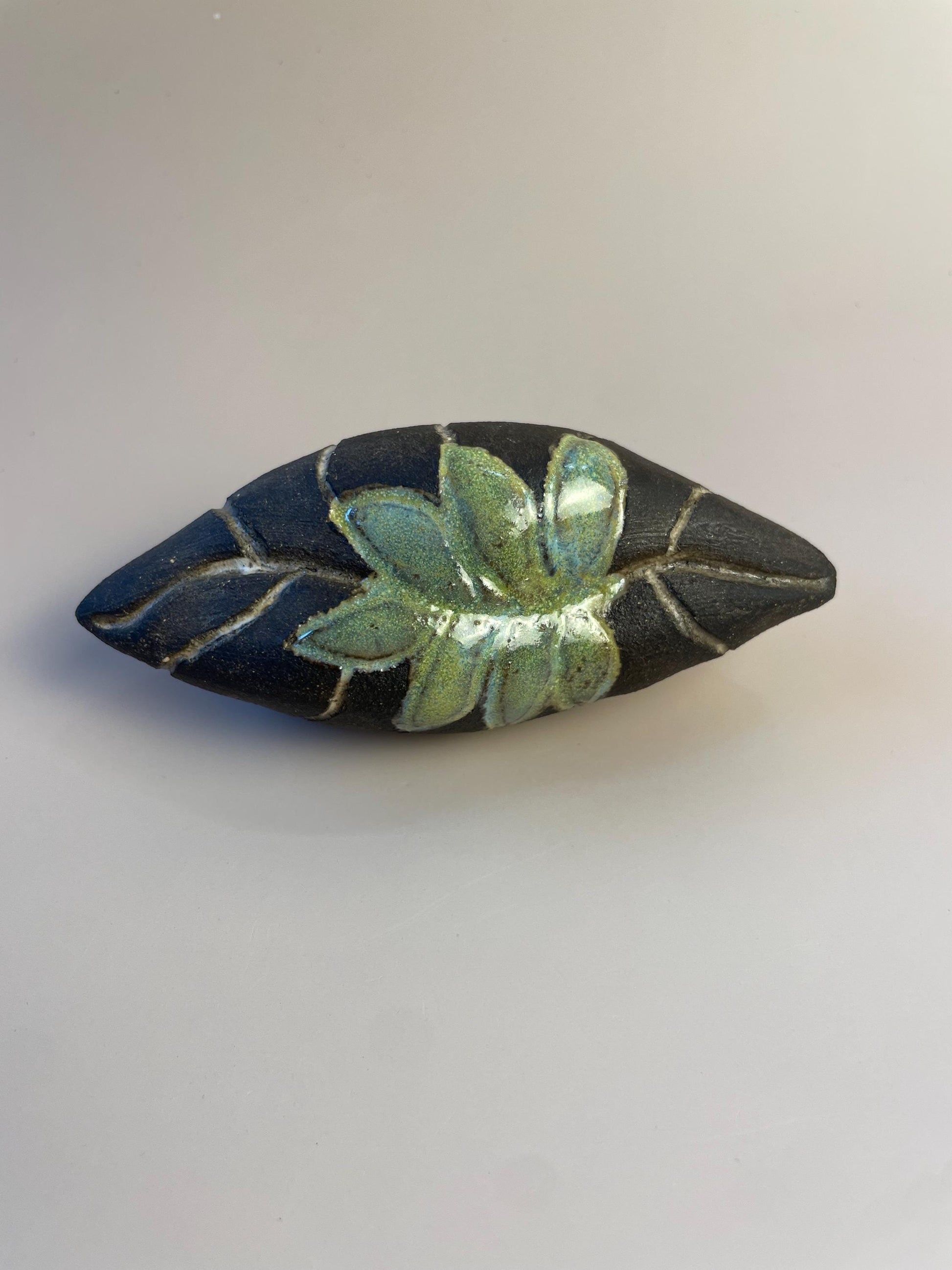 Handmade ceramic carved clay leaf rattle