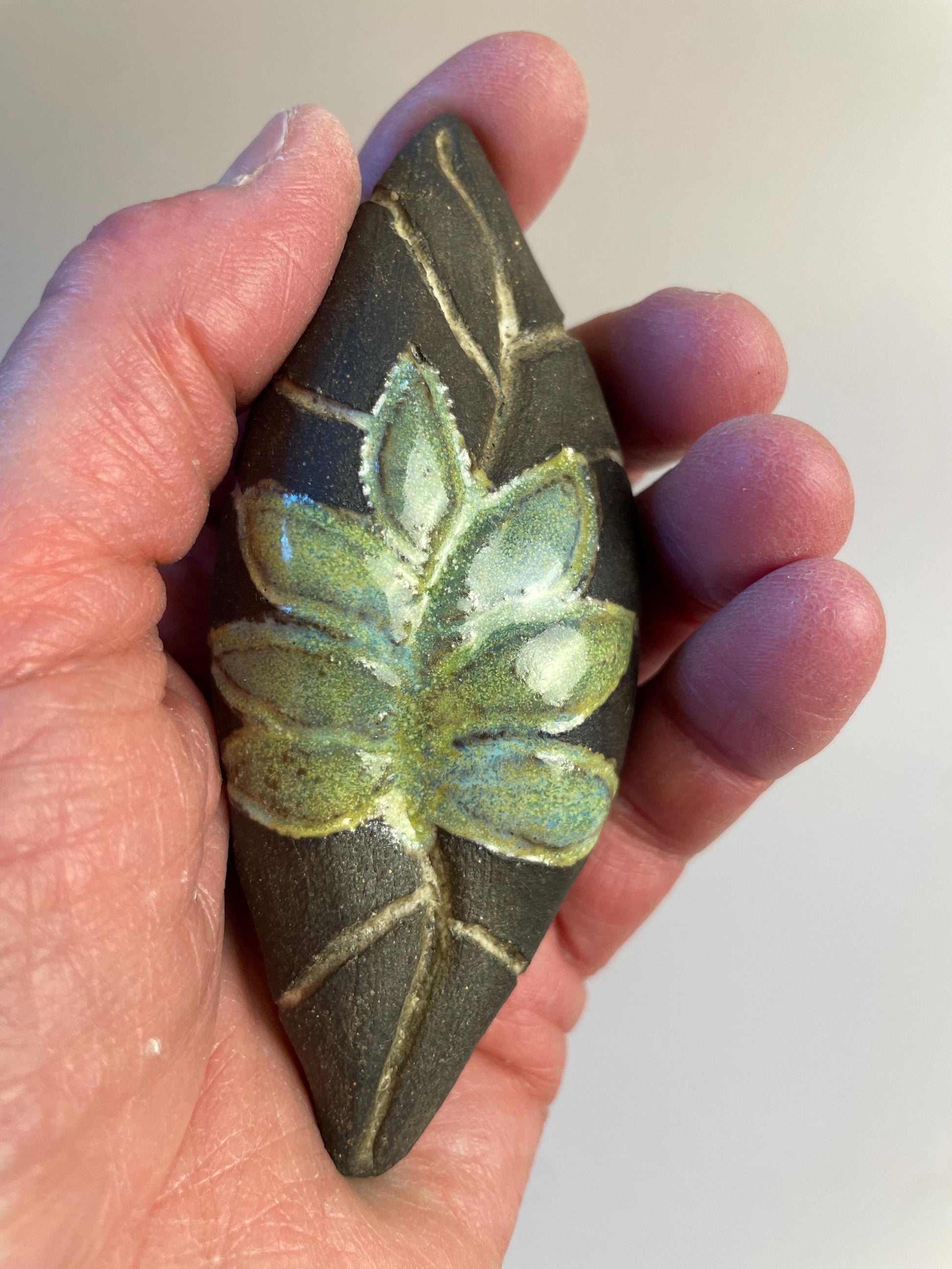 Handmade ceramic carved clay leaf rattle
