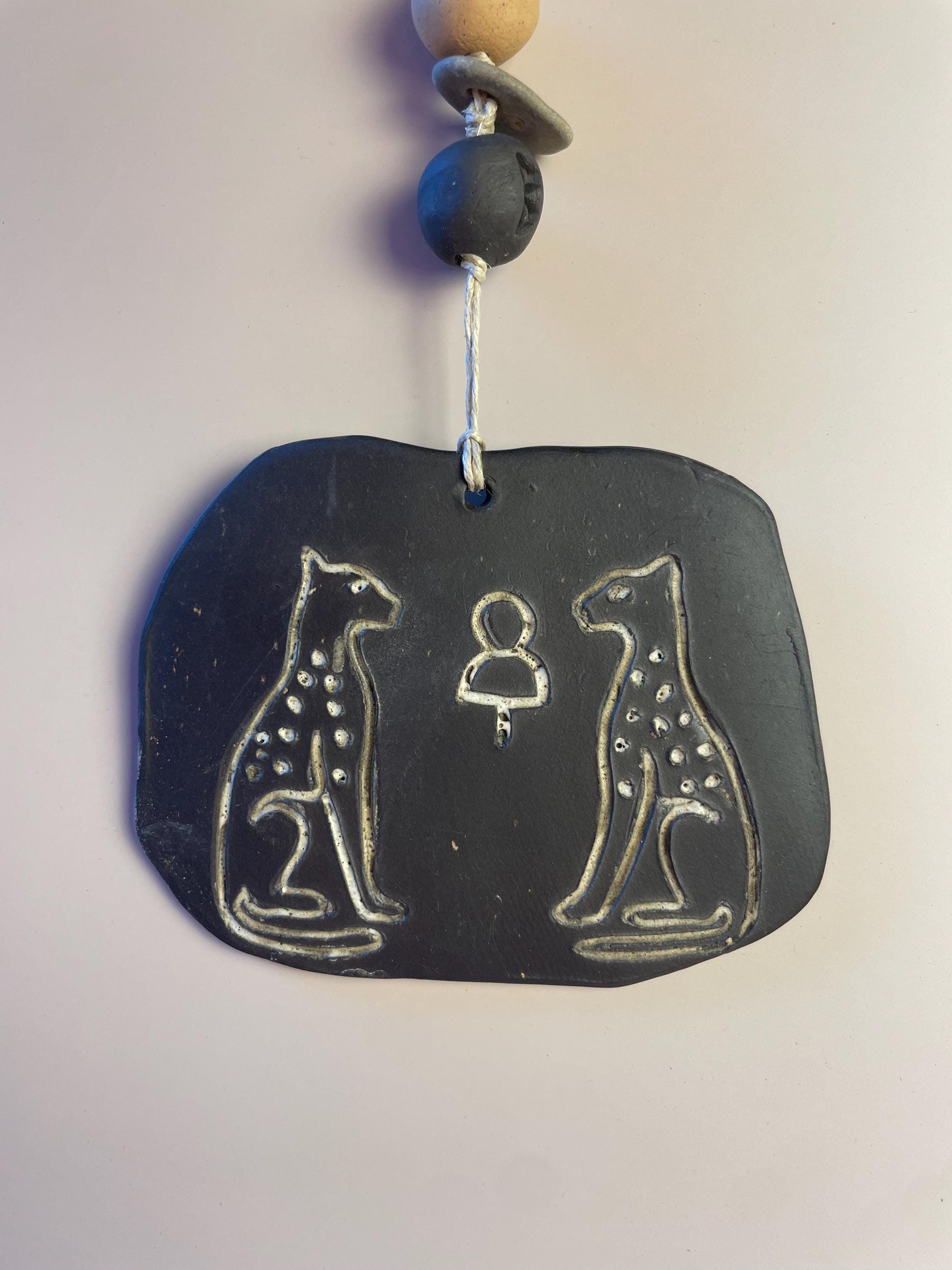 Inanna’s Guardians | Ceramic Wall Talisman with Cheetahs, Berkana Rune Bead & Hag Stone