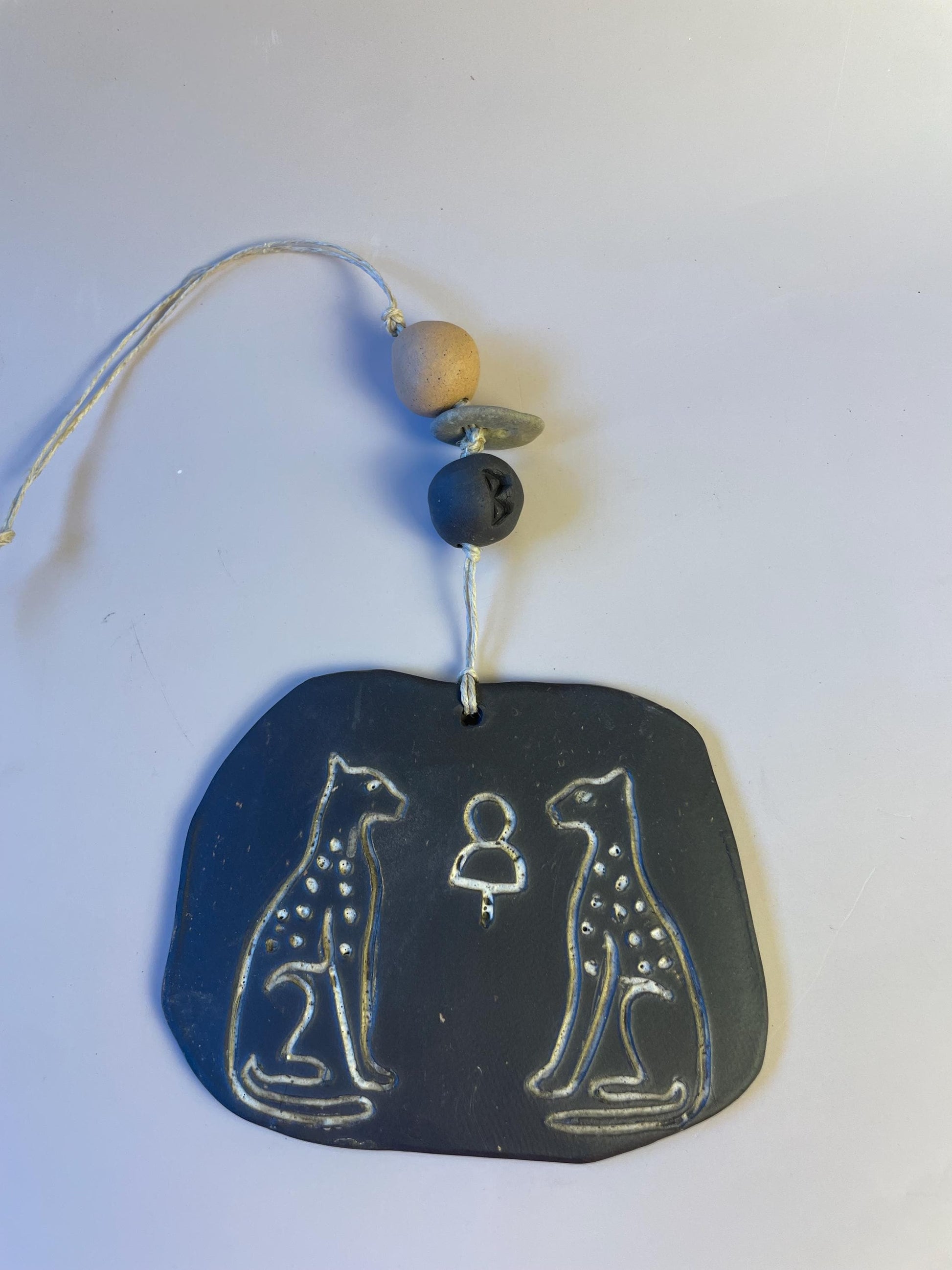 Inanna’s Guardians | Ceramic Wall Talisman with Cheetahs, Berkana Rune Bead & Hag Stone