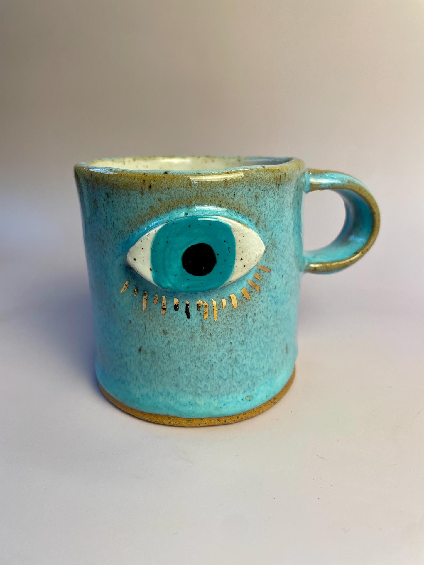 Aqua Eye Mug with Gold Luster Rays – Hand-Built Ceramic Cup | Honey Clay Mug with All-Seeing Eye | Symbolic Artisan Pottery