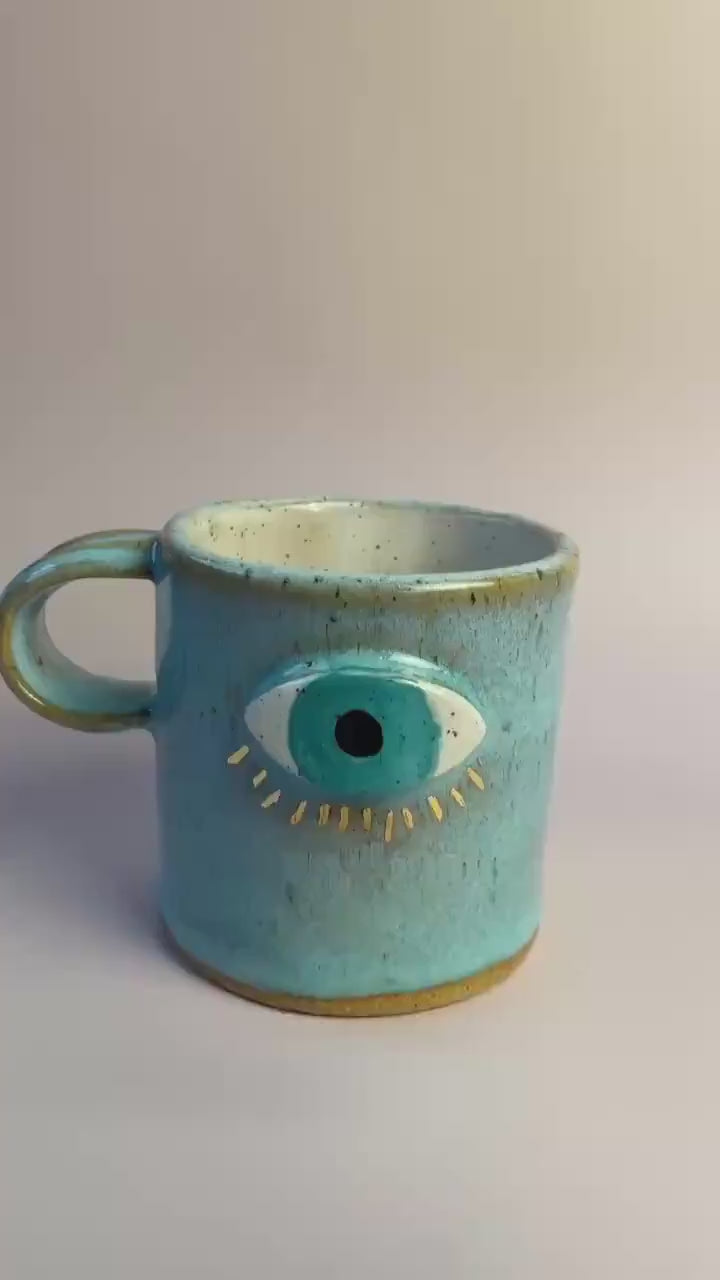 Aqua Eye Mug with Gold Luster Rays – Hand-Built Ceramic Cup | Honey Clay Mug with All-Seeing Eye | Symbolic Artisan Pottery