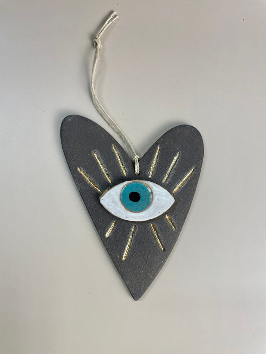 Handmade ceramic heart with evil eye charm