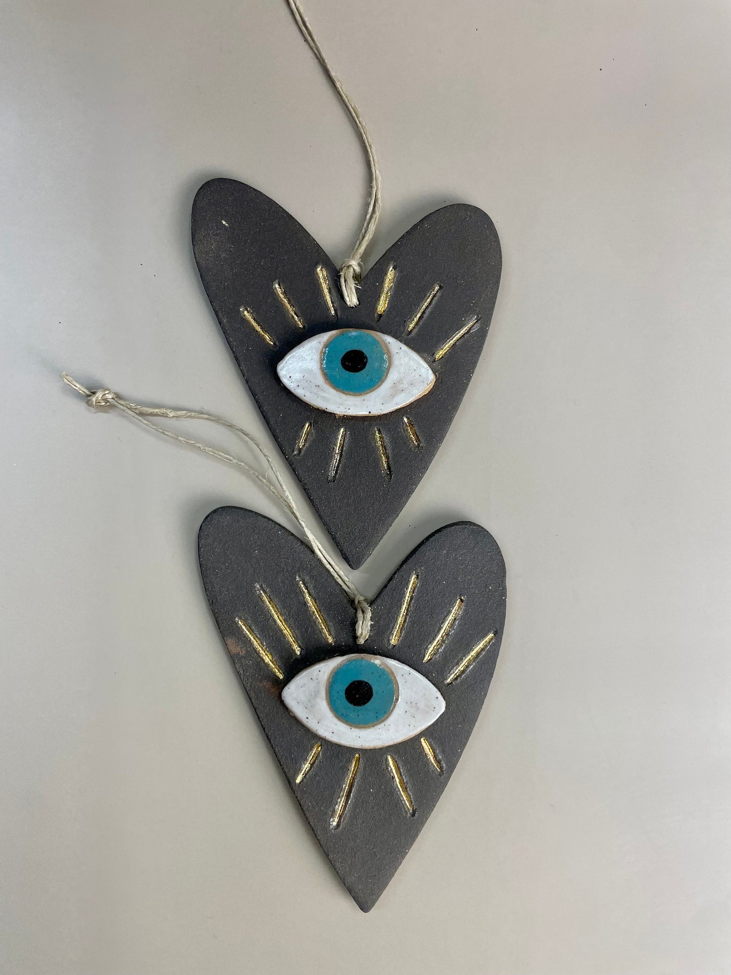 Handmade ceramic heart with evil eye charm