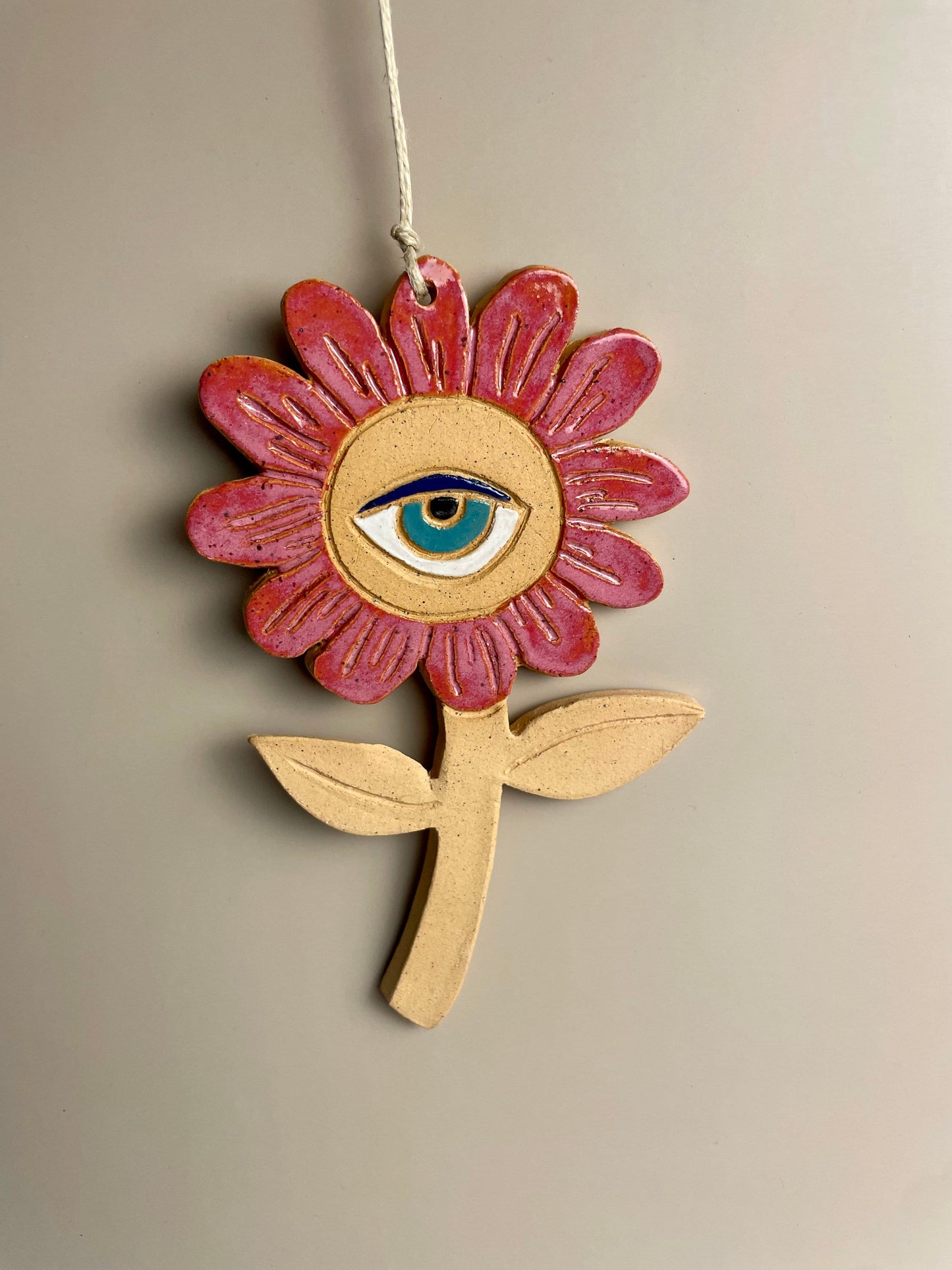 Ceramic flower ornaments with eyes