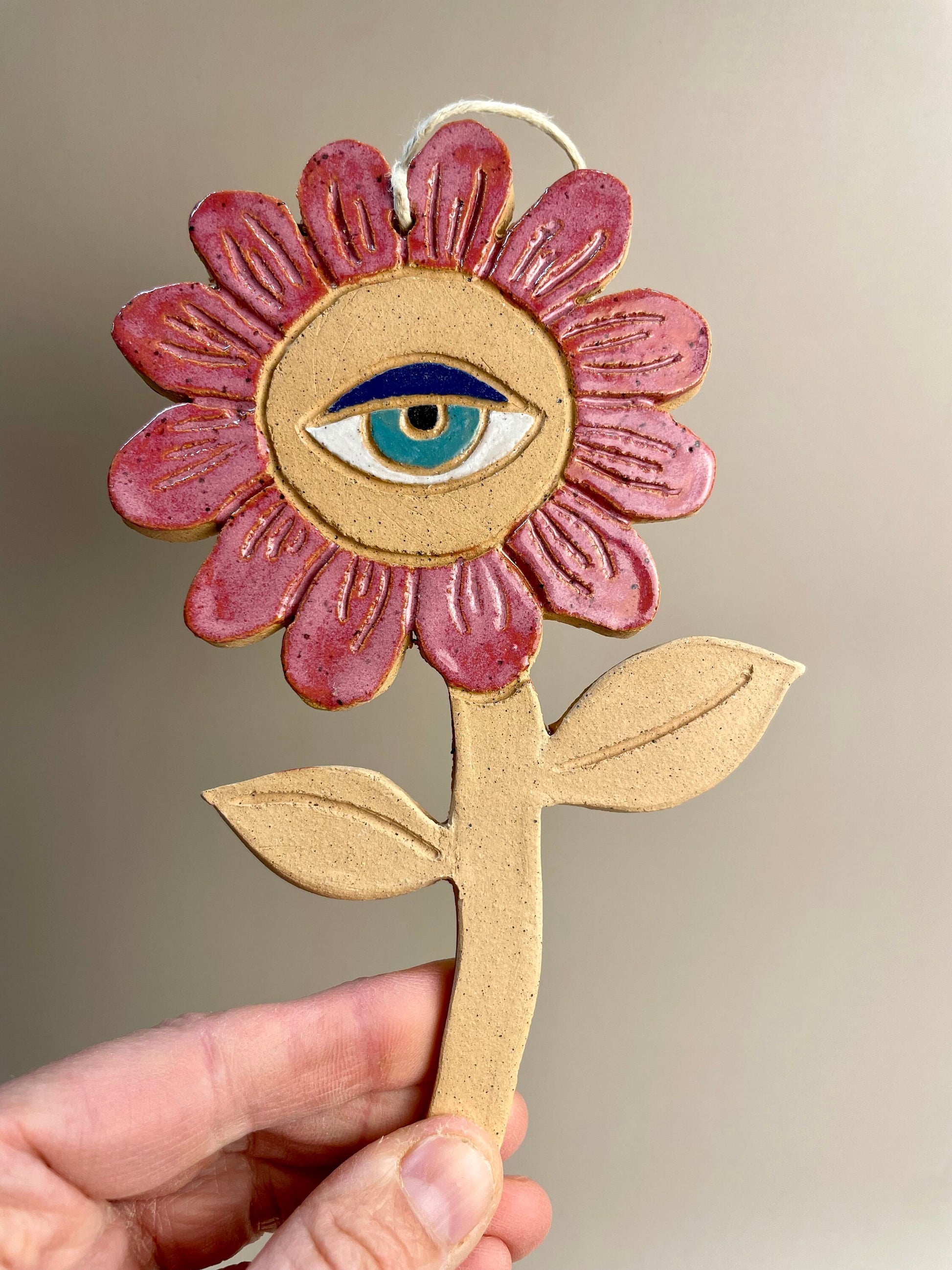 Ceramic flower ornaments with eyes