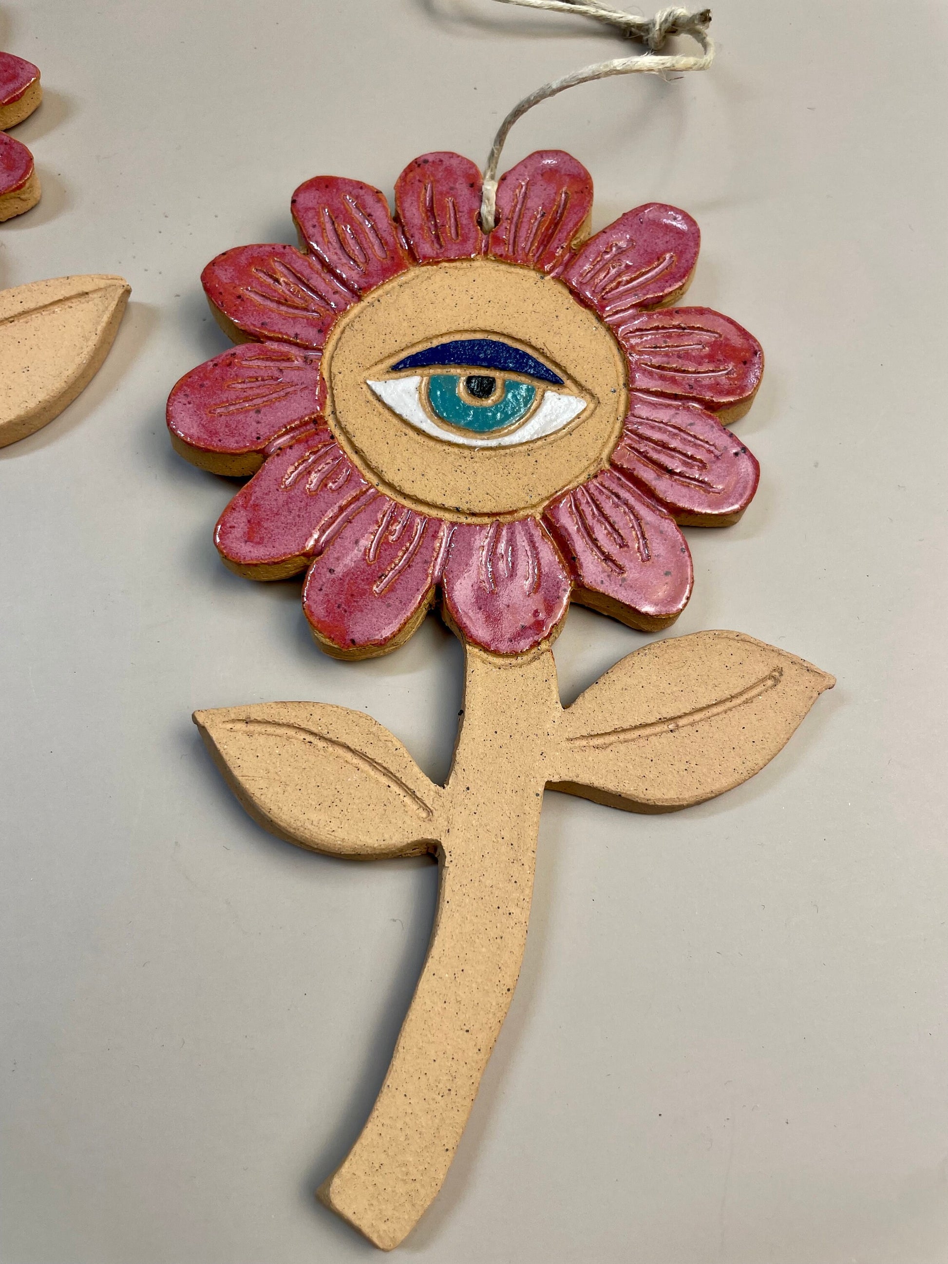 Ceramic flower ornaments with eyes