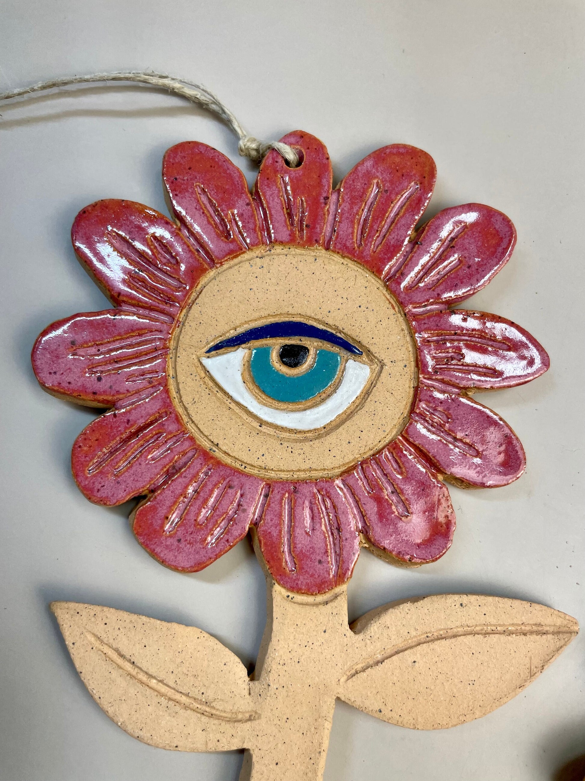 Ceramic flower ornaments with eyes