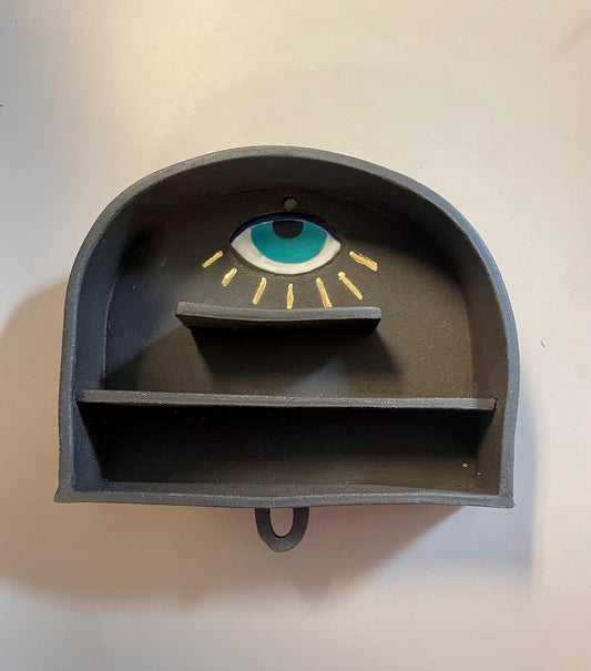 Handmade altar shelf with evil eye and gold rays