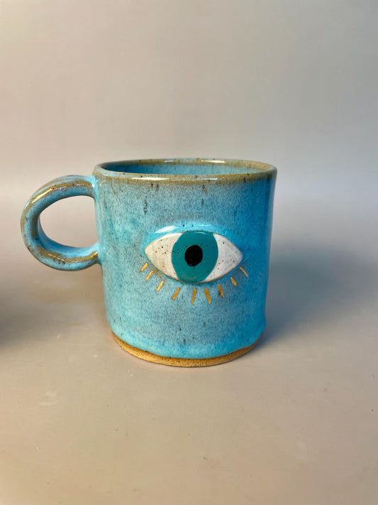 Handmade ceramic aqua evil eye mug with gold luster