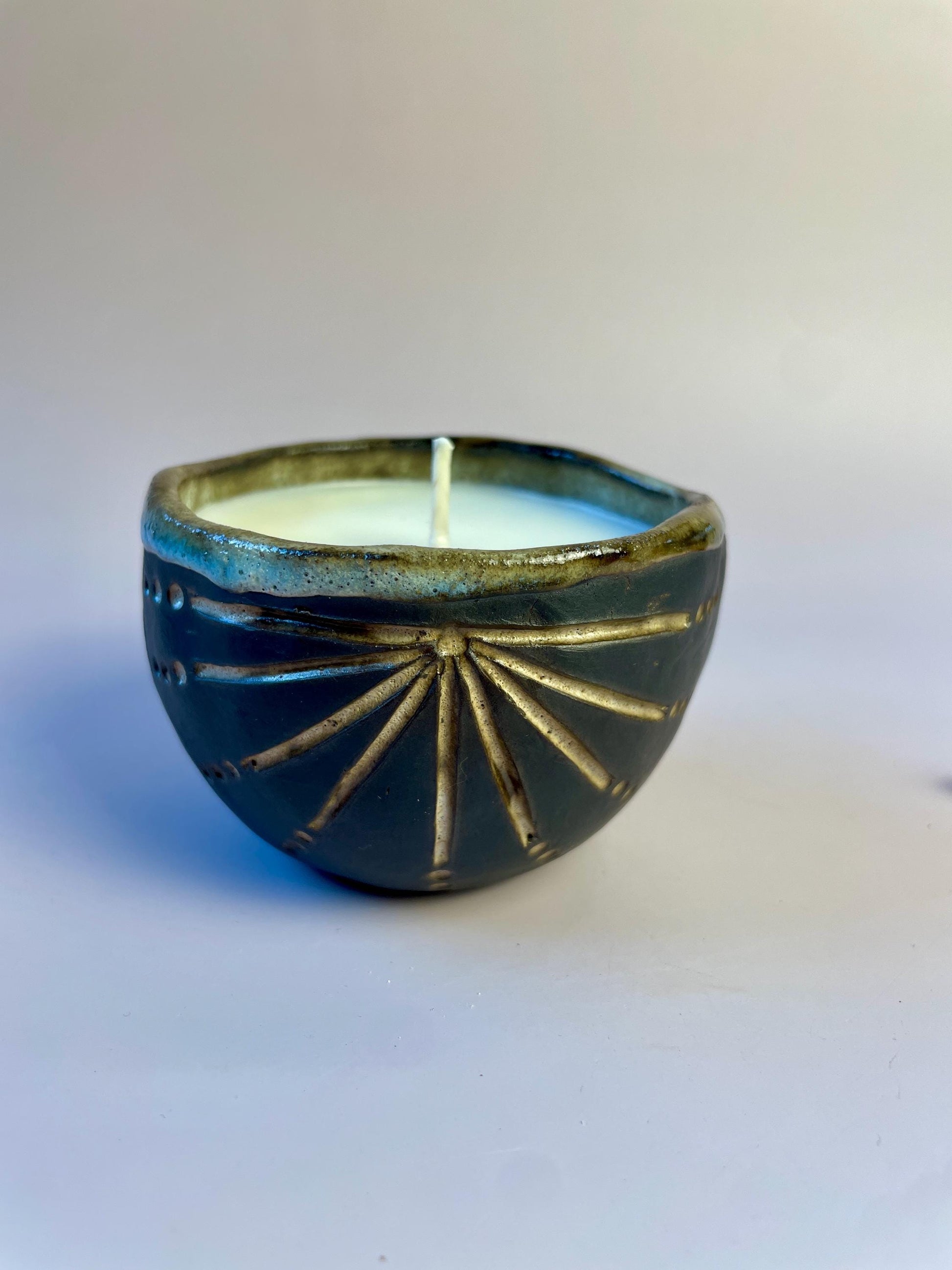 Newgrange-Inspired Ritual Candle – Hand-Carved Dark Clay Vessel, Apricot Wax, Sacred Spiral Symbol | Winter Solstice Edition