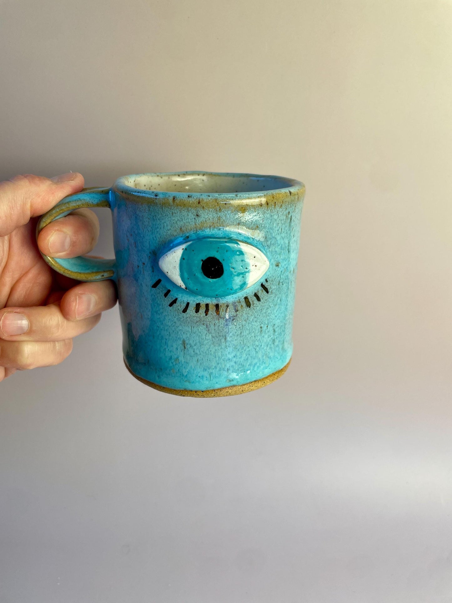 Aqua Eye Mug with Gold Luster Rays – Hand-Built Ceramic Cup | Honey Clay Mug with All-Seeing Eye | Symbolic Artisan Pottery