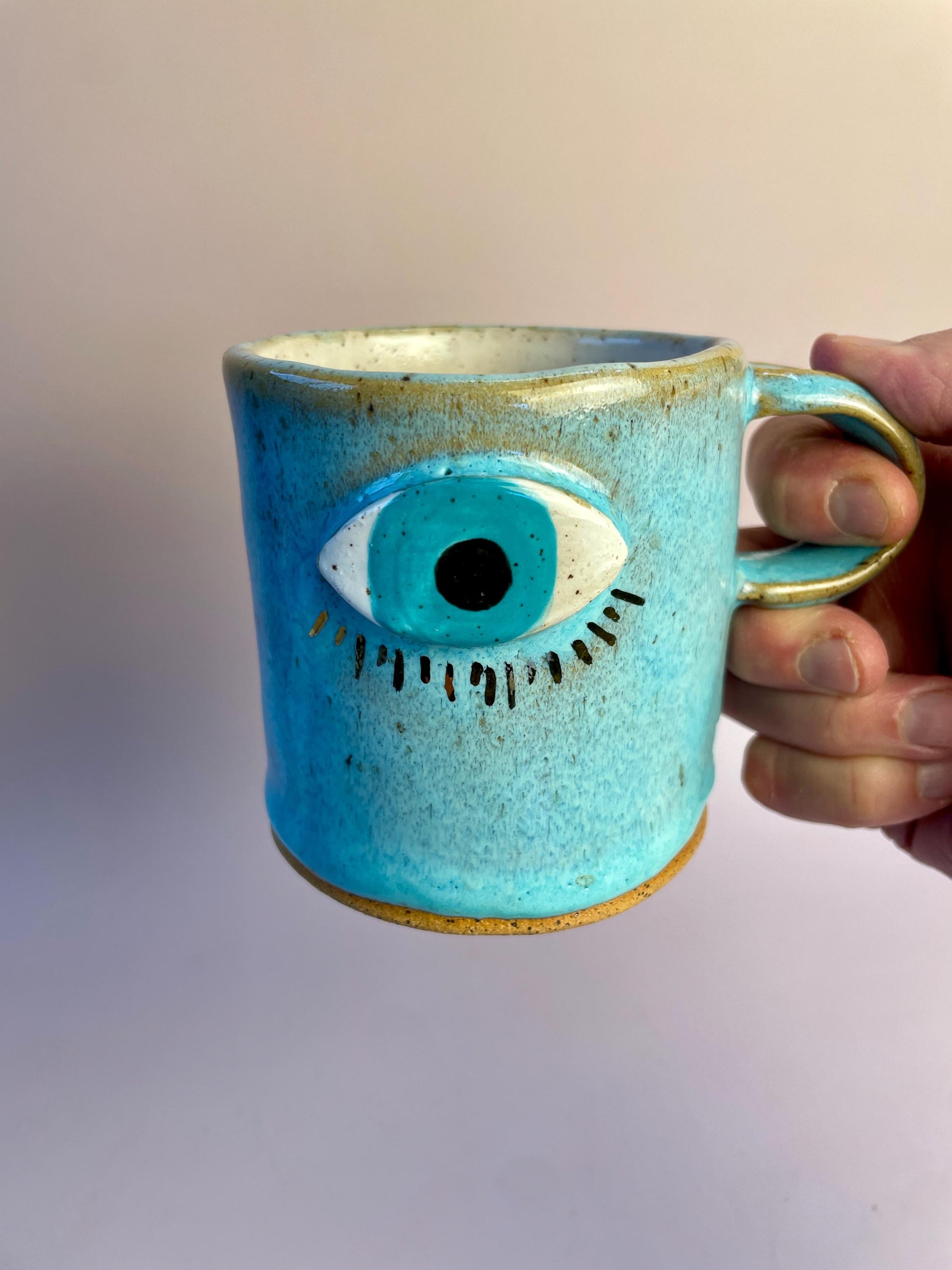 Aqua Eye Mug with Gold Luster Rays – Hand-Built Ceramic Cup | Honey Clay Mug with All-Seeing Eye | Symbolic Artisan Pottery