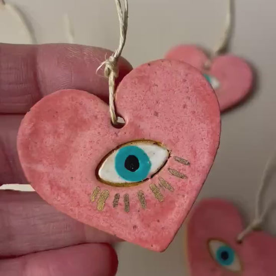 Handmade ceramic heart with eye charms
