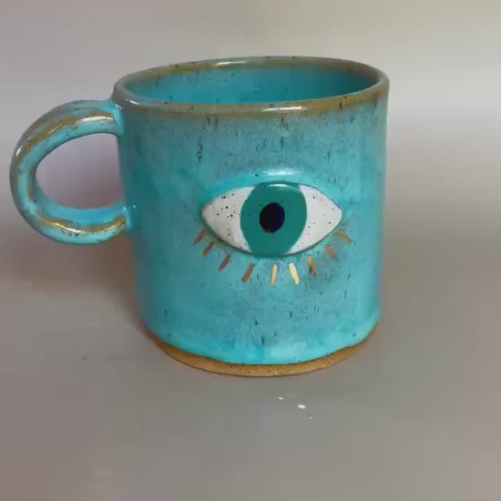 Handmade ceramic aqua evil eye mug with gold luster
