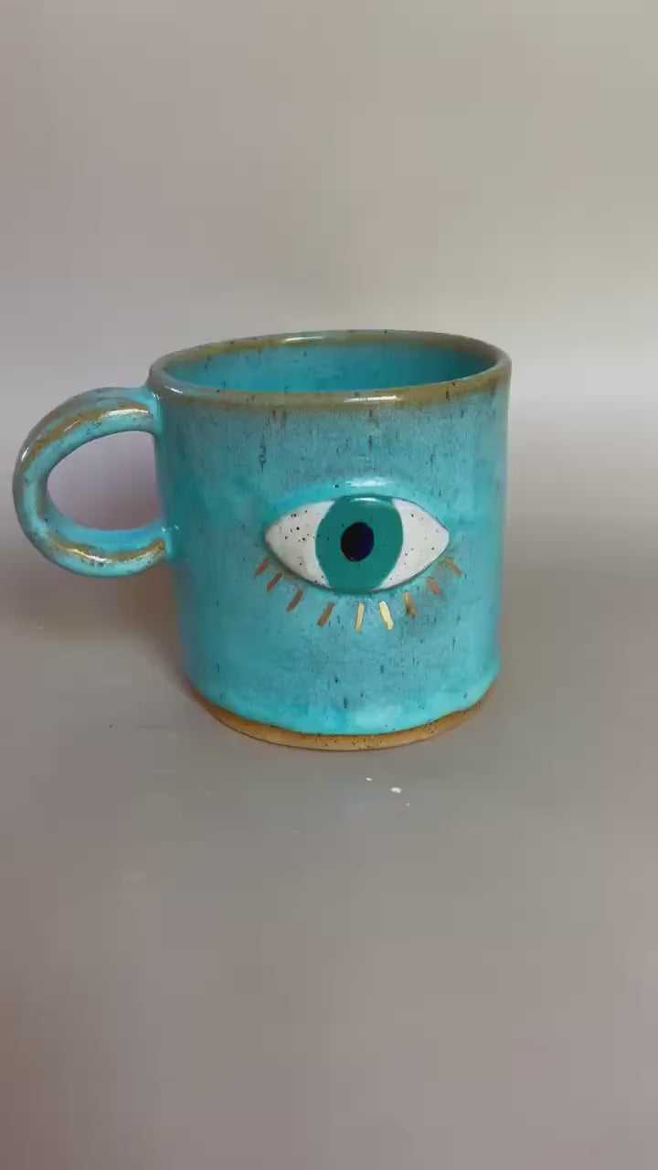 Handmade ceramic aqua evil eye mug with gold luster