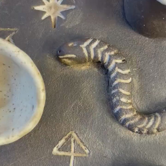 Handmade ceramic four element ritual dish with snake and celestial symbols