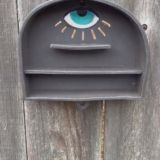 Handmade altar shelf with evil eye and gold rays