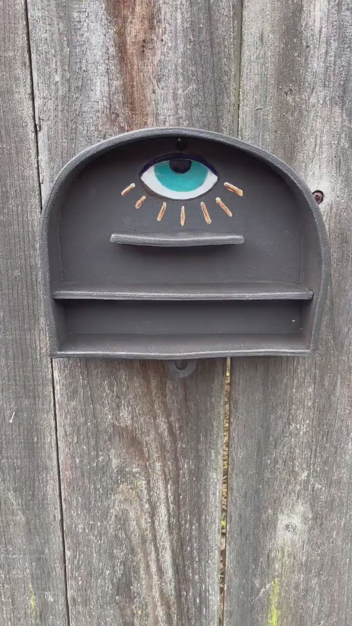 Handmade altar shelf with evil eye and gold rays